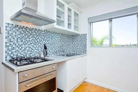 Near shops, train line & beach... this lovely 1 bedroom, furnished apartment is ready for Summer! - Photo 5