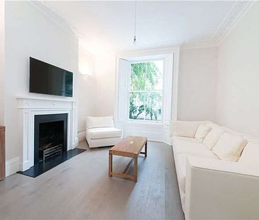 This four bedroom townhouse is tucked away on a quiet street moments from the amenities of the Kings Road. - Photo 2
