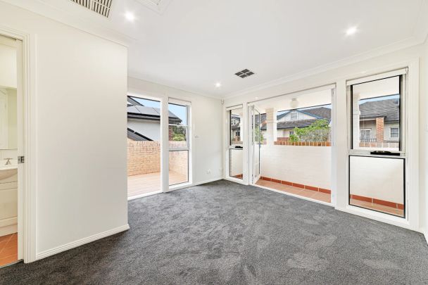 Newly Renovated Resort-Style Estate with Tennis Court and Pool in Prestigious Oatlands - Photo 1