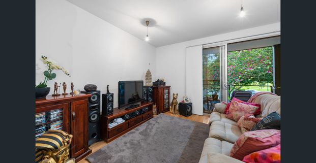 STYLISH AND WELL-PRESENTED FIRST LEVEL UNIT WITH BALCONY - Photo 1