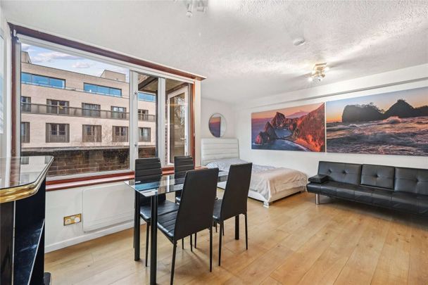 Situated in a secure development near St James's Park, London. This property offers bright and generous living space, an open-plan kitchen, a private balcony, private parking. - Photo 1