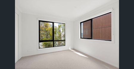 Modern 2-Bedroom Townhouse in a Stylish Community Setting - Photo 2