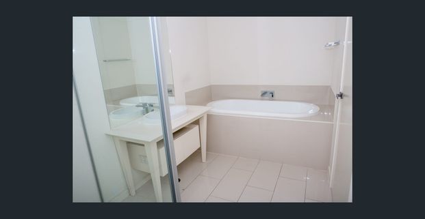 NEW CARPERT -Stylish townhouse that offers you the Gold Coast Living. Bordering the Glades Golf course, - Photo 1