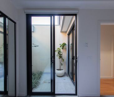 Architectural Townhouse In Brunswick Awaits - Photo 4