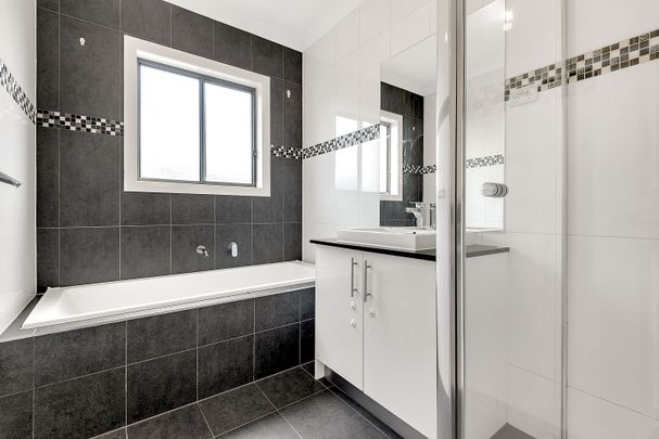 This lovely home is situated in a prime location, close to public transport - Photo 1