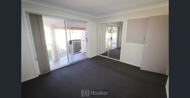 UPDATED THREE BEDROOM TOWNHOUSE BY THE LAKE! - Photo 1