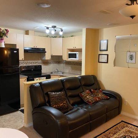 Professionally Furnished Basement Suite Near Airport - Photo 1