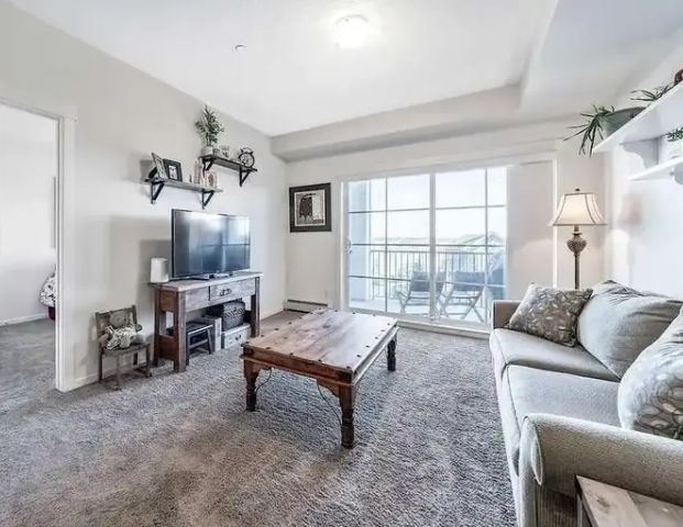 Beautiful 3rd Floor Condo with Stunning Pond Views | Calgary - Photo 1