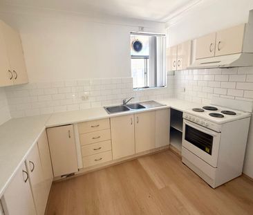 Newly Renovated Top Floor Unit - Photo 3
