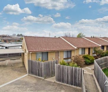 Conveniently located two-bedroom unit - Photo 1