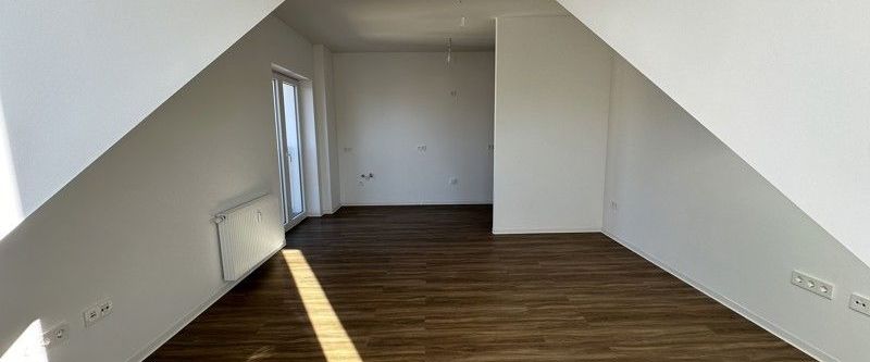 Helle 1-Zi.-Dachgeschosswohnung mit Ausblick - Foto 1