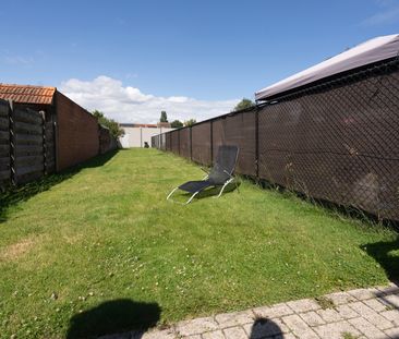 GELIJKVLOERS APPARTEMENT MET GARAGE EN RUIME TUIN - Foto 5