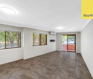 SPACIOUS AND SUN-FILLED TWO BEDROOM APARTMENT IN BOUTIQUE BLOCK - Photo 1