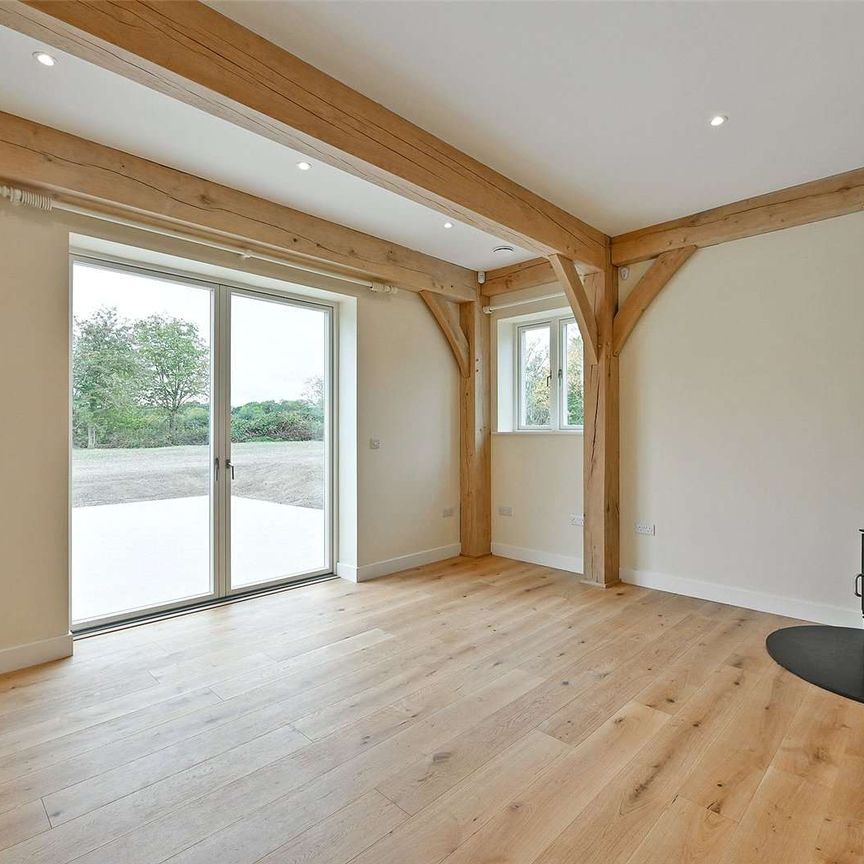 A grand oak-framed country home with vaulted ceilings and striking architectural detail - Photo 1