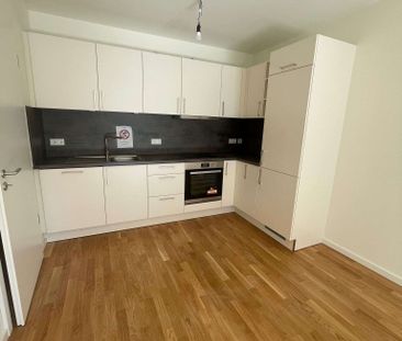 KfW 40-Neubau-Wohnung mit EBK, Balkon, Echtholzparkett, Fahrstuhl, Tiefgarage - Photo 1