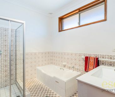 Charming Four-Bedroom Home with Garage and Convenient Location - Photo 4
