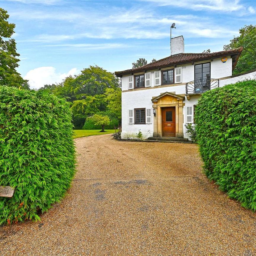 Situated in one of the most sought after roads in Englefield Green, a detached house full of character set in magnificent gardens with swimming pool. - Photo 1