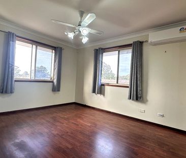 Comfortable 3 Bedroom Home with Great Features & Secure Outdoor Living - Photo 4