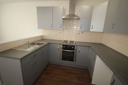 ****Available NOW*** PROPERTY OPTIONS are pleased to offer a first floor one bedroom flat ideally located to the city centre Large open plan lounge/kitchen Lounge having electric heaters. Kitchen with breakfast bar, electric oven, hob and extractor fan, and fridge included in the flat. - Photo 2