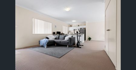 Nestled in a peaceful complex, this delightful two-bedroom unit offers comfort and convenience - Photo 4
