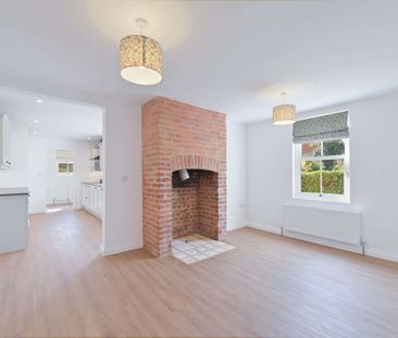 Beautifully renovated three bedroom home with versatile living space - Photo 2