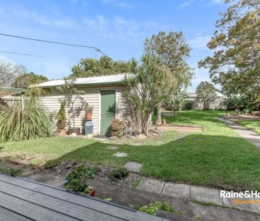 “Tidy solid home with a lush backyard” - Photo 1