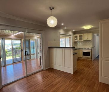 Bright Family Home with Sunroom and Outdoor Living Space - Photo 4