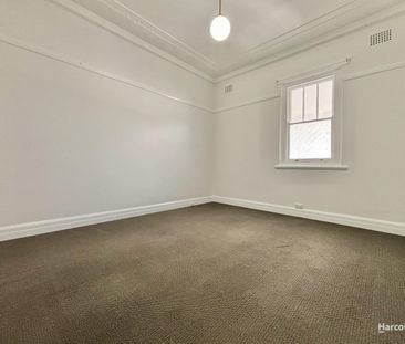 Charming Three Bedroom Home with Sunroom & Large Backyard... - Photo 1