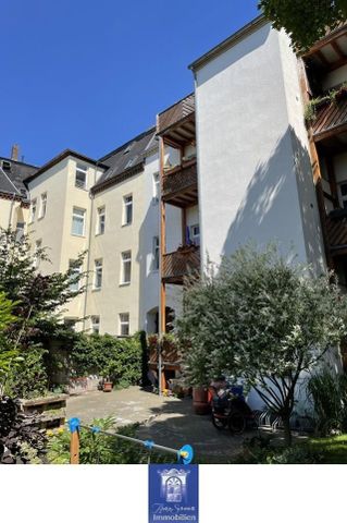 Perfekte Dachwohnung mit groÃem Balkon und tollen Blick in den grÃ¼nen Innenhof! - Foto 5