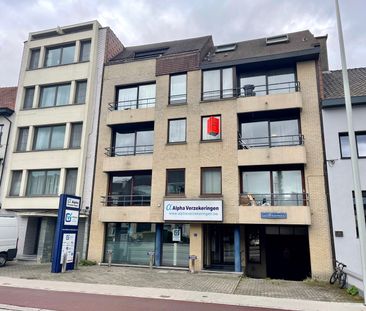 Centraal gelegen appartement met terras en autostaanplaats - Photo 4