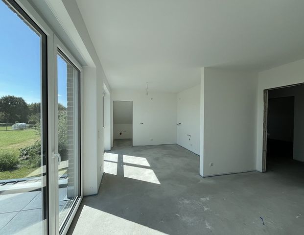 Vermietung: Erstbezug, moderne Obergeschosswohnung mit Balkon und Carport in Westoverledingen - Foto 1