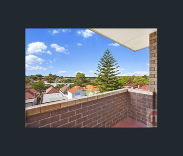 TOP FLOOR APARTMENT WITH PRIVATE BALCONY & EXPANSIVE AREA VIEWS! - Photo 4