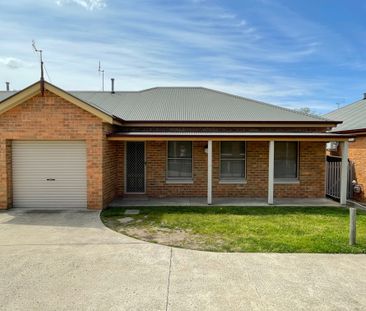 Elegant 2-Bedroom Unit Close to Town - Photo 6