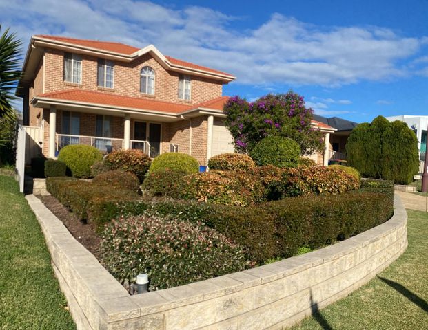 Sophisticated 5 Bedroom Family Home With Triple Car Garage - Photo 1