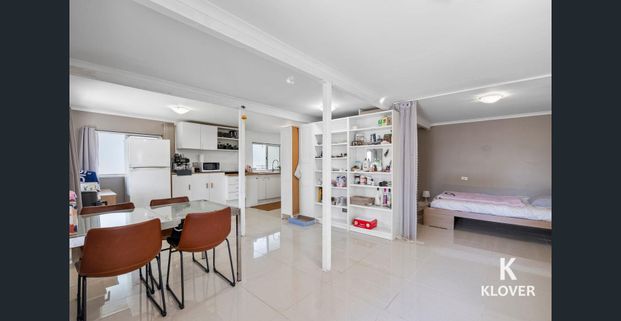 Spacious Home with Dual Living Potential in the Heart of Woodridge - Photo 1