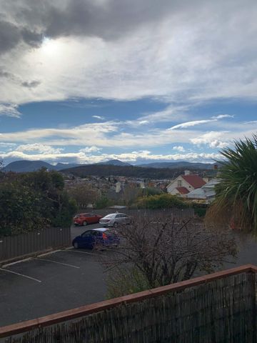 Located in a secure complex with a sunny outlook - Photo 2