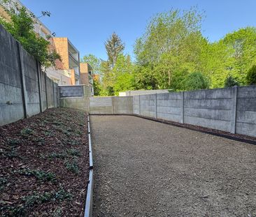 Vernieuwd appartement met 1 slaapkamer en tuin - Photo 3