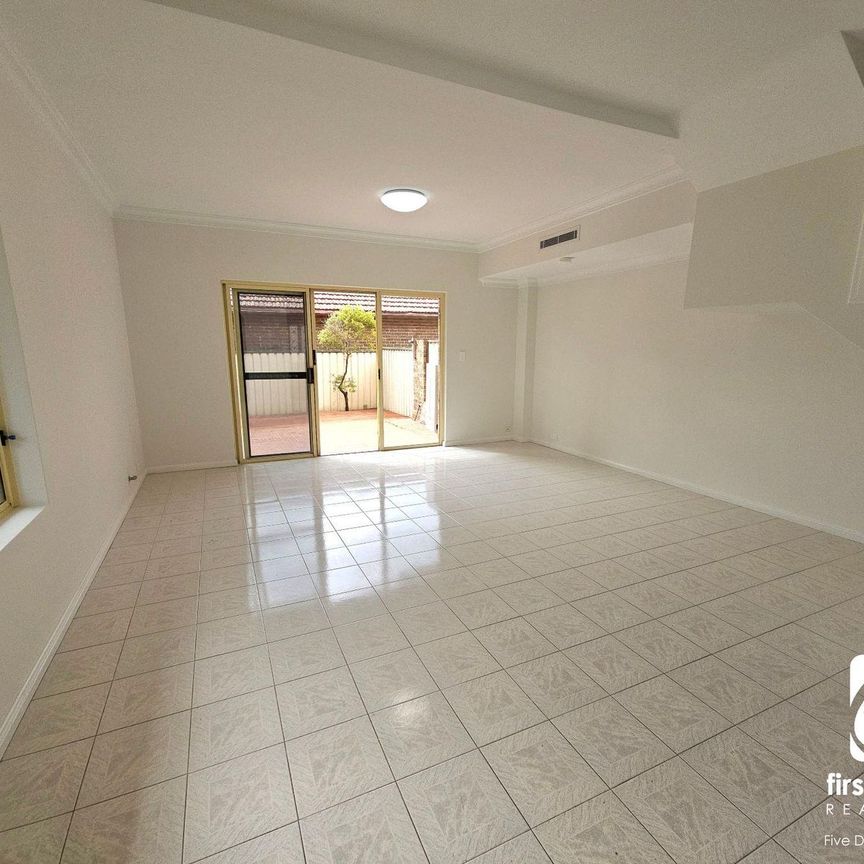 BEAUTIFULLY PRESENTED TOWNHOUSE WITH DOUBLE LOCK-UP GARAGE - Photo 1