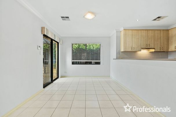 Elegant Street Frontage Home with Modern Comforts and Entertaining Space - Photo 1