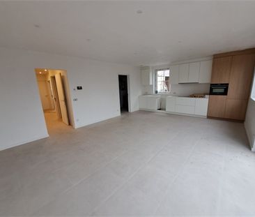 Een gelijkvloers nieuwbouwappartement met terras - Foto 3
