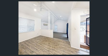 Spacious Family Retreat with Poolside Entertaining in Leafy Jindalee - Photo 4