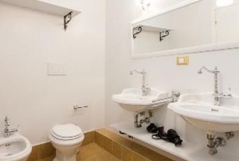 Center-Historic Jewish Quarter: Elegant apartment situated in beautiful Palazzo Nobiliare. Entrance, spacious living with original wood frescoed ceilings, large modern dining and kitchen, 4 bedrooms, 4 Baths, small terrace. #1527