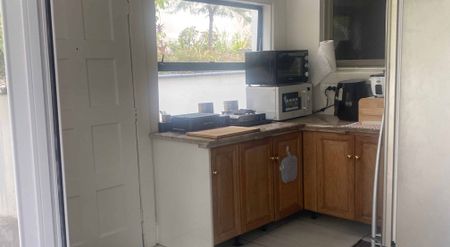 Unit under the house with private backyard - Photo 4