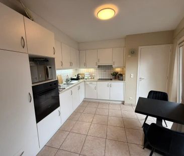 GELIJKVLOERSAPPARTEMENT MET TERRAS EN GARAGE IN HET CENTRUM VAN TIELT. - Foto 4