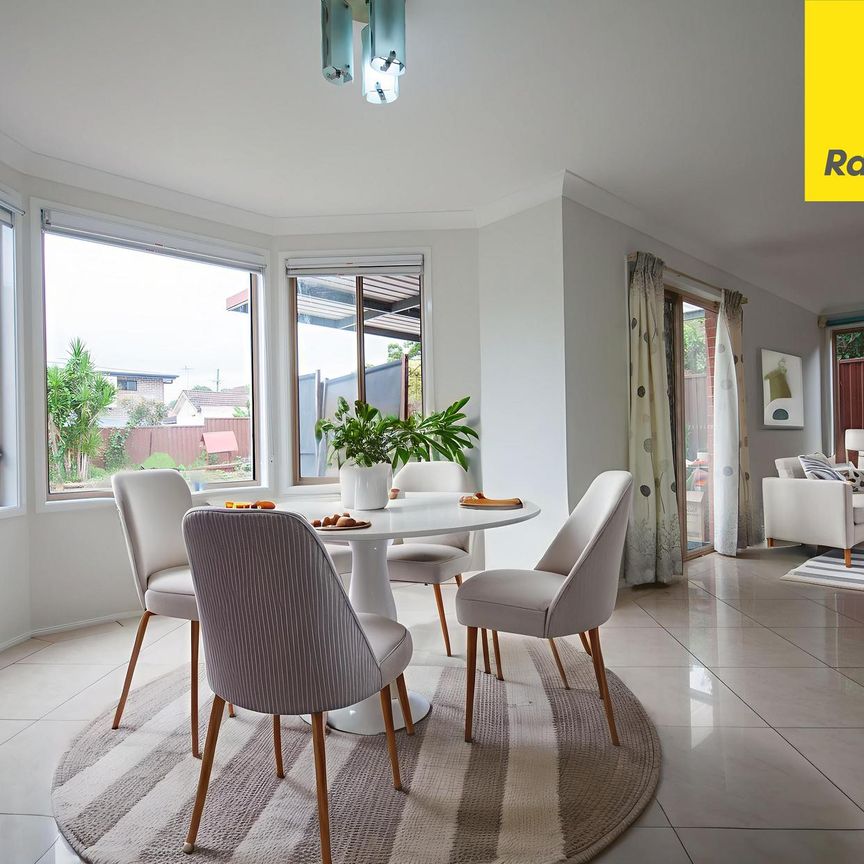 SPACIOUS 4 BEDROOM TWO LEVEL FAMILY HOME WITH MULTIPLE LIVING AREAS - Photo 1