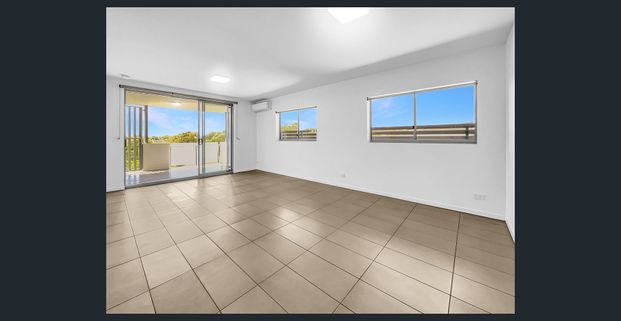 Top-Floor Bliss with Stunning NE Outlook – Perfect for Lifestyle Seekers! - Photo 1