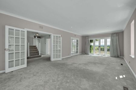 An attractive six bedroom family home set within mature grounds on the prestigious St George's Hill Estate, offering generous family accommodation, a swimming pool and far-reaching views. - Photo 3