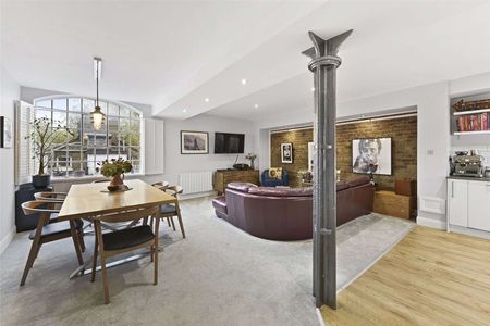 A wonderfully appointed, two bedroom apartment situated on the fourth floor of this charming warehouse conversion located in the heart of West Wapping. - Photo 4