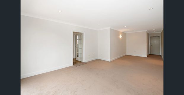 Top floor apartment in sought after Location - Photo 1