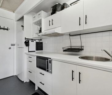 Updated Convenient Studio with Rooftop Pool | Furnished - Photo 2